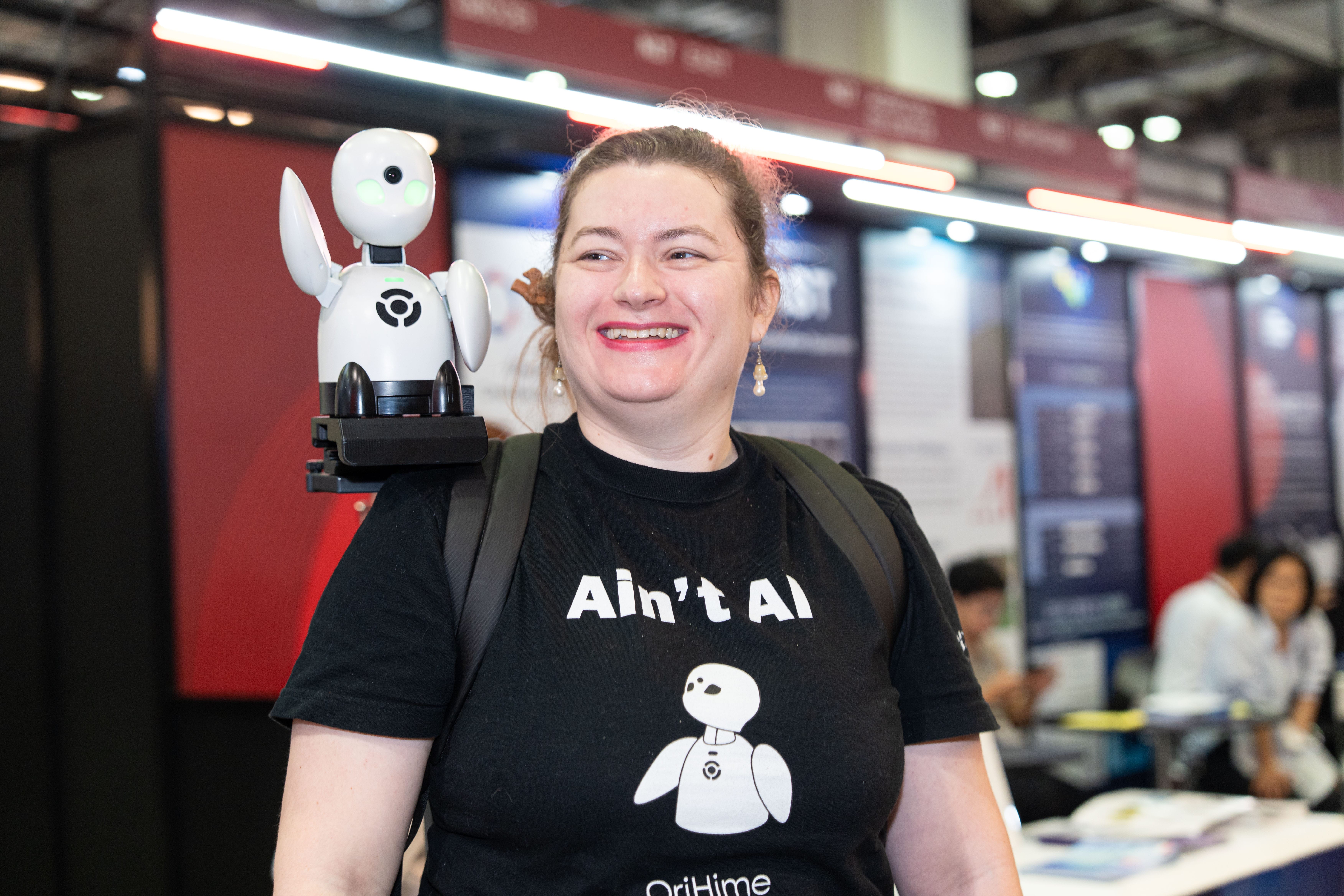 An exhibitor Showcases one of their robotics innovations